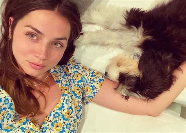 Ana De Armas Wears Floral Print HVN Dress As She Snuggles With Her Puppy