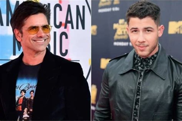 John Stamos ‘Gets Tattoo’ Of Nick Jonas’ Face Amid Their Hilarious Troll War