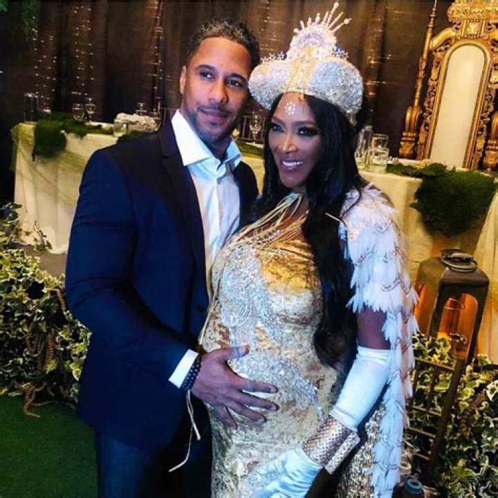 Kenya Moore’s Husband, Marc Daly, Kisses His Lookalike Baby And Flaunts Massive Muscle In New Picture
