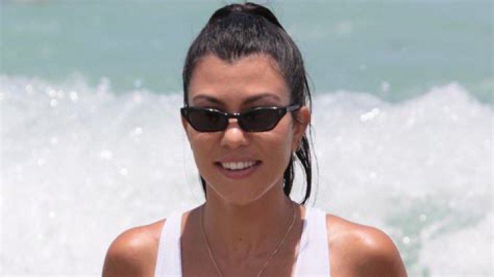 Kim Kardashian in Bathing Suit Poses Poolside — Celebwell