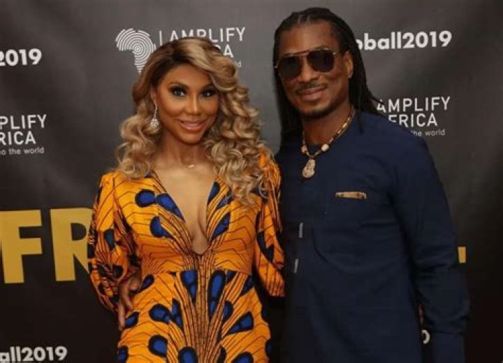 Tamar Braxton Blows People’s Minds In A Red Latex Outfit And Snatches Her Wig Off On Stage